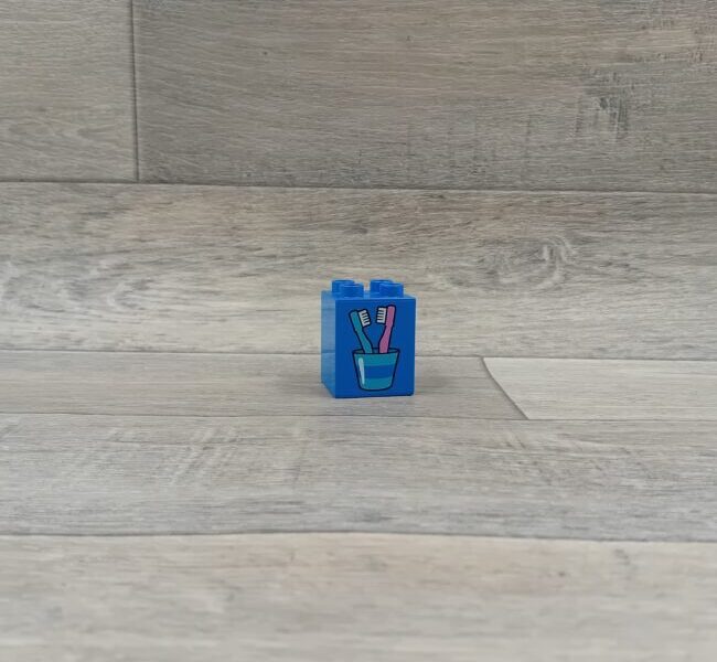Duplo blok met afbeelding blauw beker met tandenborstels